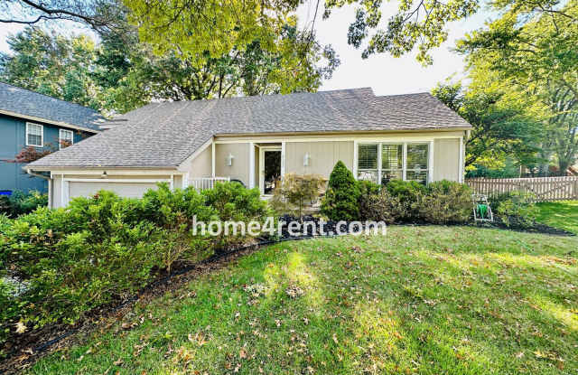 Photo of A Lovely Lenexa Home w/ Wood Floors Throughout, Updated Kitchen, Finished Basement and a Fenced Yard!