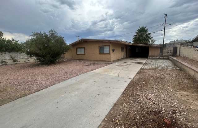 Single story home with large backyard and huge carport with plenty of storage.