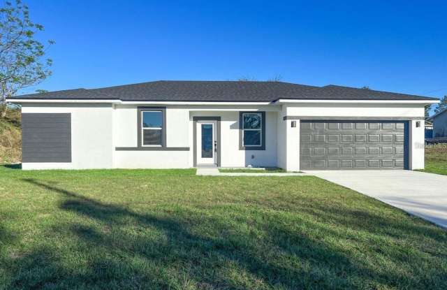 Photo of This immaculate, newly built 4-bed, 2-bath home in Port Charlotte is move-in ready or perfect for renting out!