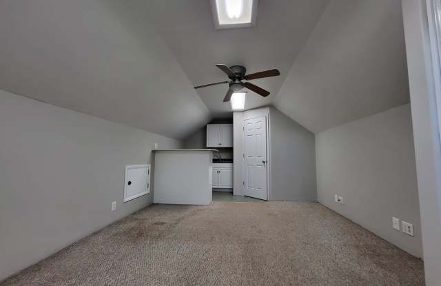 Studio loft next to UCO campus with deck and fenced yard