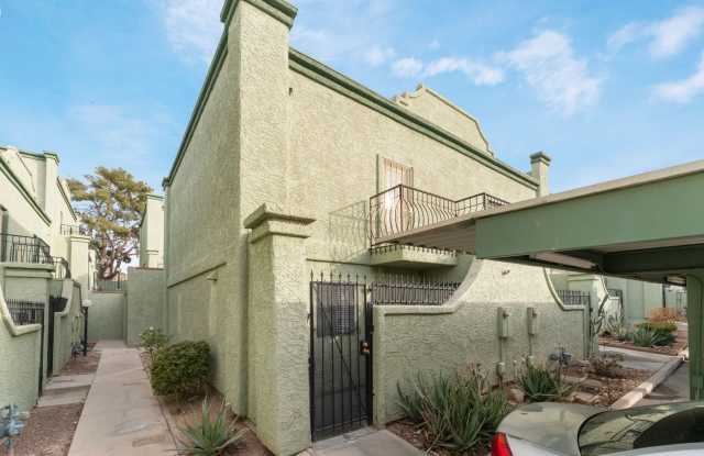 Charming two story townhome with all of the amenities and two balconies. Must come see!!