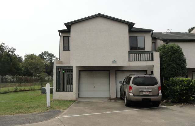 AWESOME 2/2 w/ 2 Car Garage, Deck w/ Lake View, Wood Floors, W/D,  More! $1450/month Avail July 1st! - 1337 Airport Drive, Tallahassee, FL 32304