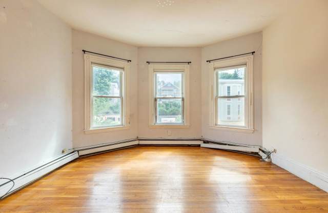 Photo of Massive 5 Bed / 2 Bath Duplex in Mission Hill — 2,000 Sq Ft, In-Unit Laundry, Updated Kitchen, Prime Student Location