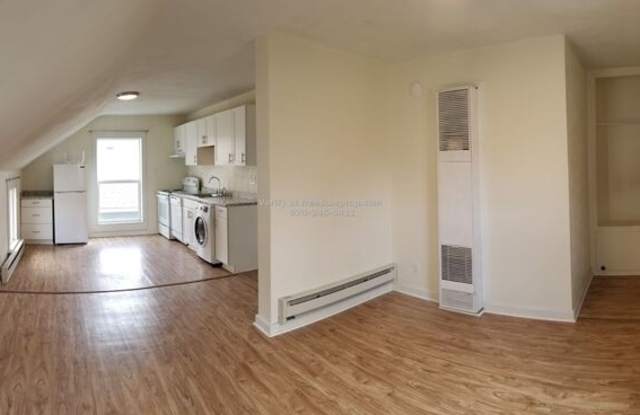 311 1/2 W First St