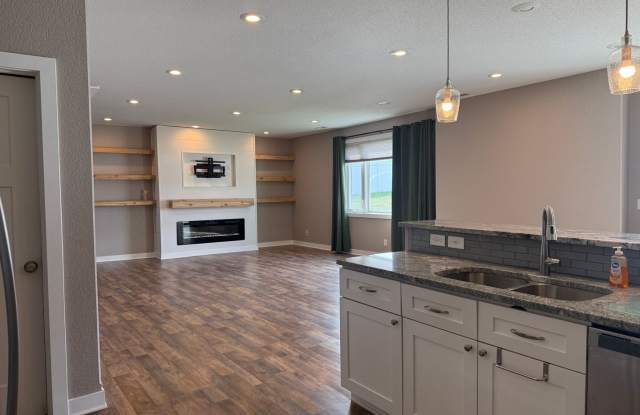 Spacious 4-Bedroom Twin Home | 3-Stall Garage + Fenced Yard