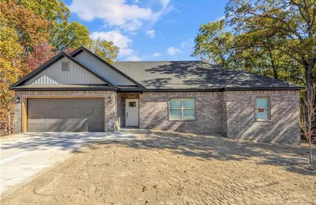 Modern open-concept living meets peaceful nature views in this custom-crafted retreat.