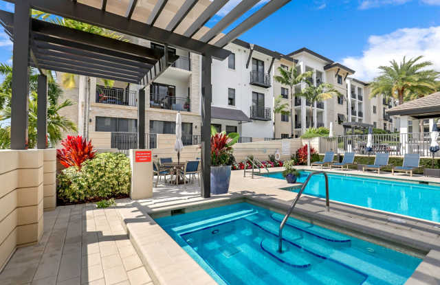 Luxury Living Meets Prime Location! Naples Square 2/2 Condo with Expansive Terrace