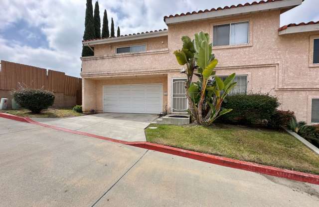 Vista home with a 2 car garage and additional parking