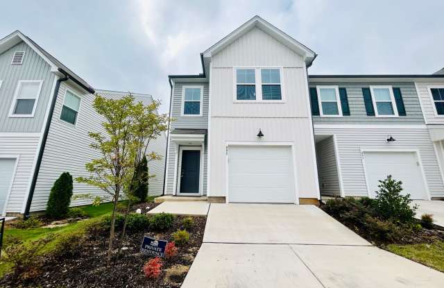 Stunning end-unit newly built 3 bedroom 2.5 bath townhouse in N High Point with attached garage.