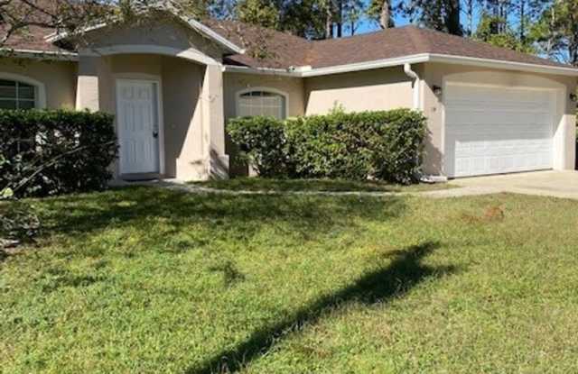 Like new 4/2/2 with screened in porch! Located close to schools, parks and town center. - 14 Rainbow Lane, Palm Coast, FL 32164