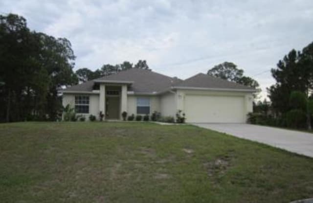 811 Homestead RD S - 811 Homestead Road South, Lehigh Acres, FL 33974