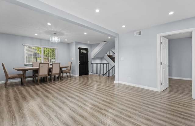 Updated Three Level Arcadia Townhome with Private Yard and Attached Garage