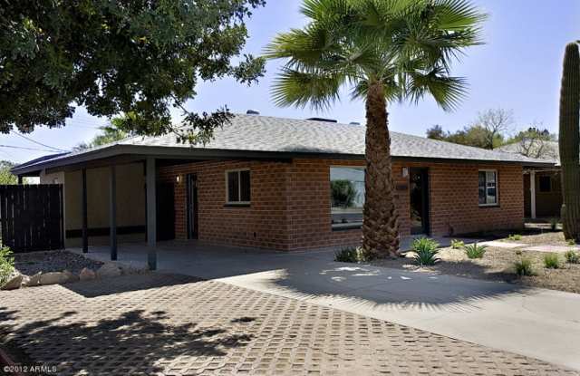 Photo of Remodeled Central Phoenix Charmer!! Cement Floors, Updated Kitchen, Old School Feel with Urban touches!!! Landscaping Included!!!