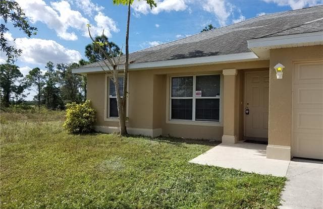 1062 Shoreland AVE - 1062 Shoreland Avenue, Lehigh Acres, FL 33974