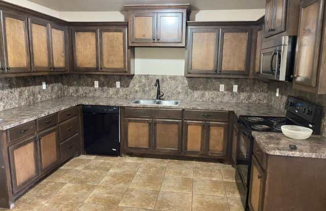 3 bed 2 bath 2 car garage in Chickasha! granite, luxury vinyl and ready for move in!