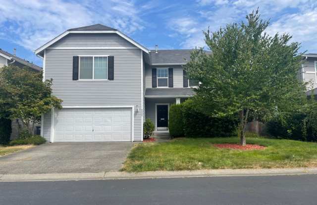 Beautiful Open Concept 4 Bedroom 2.5 Bath Home with Fenced Yard in Gated Community