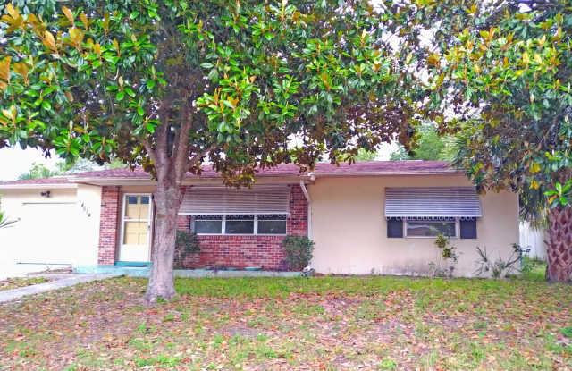 Spacious 2/2 home featuring neutral ceramic tile throughout within the heart of Spring Hill