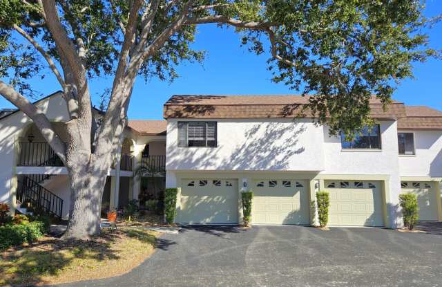 Annual Unfurnished 2nd Floor Condo at Summer Green Capri Isles with a Garage!