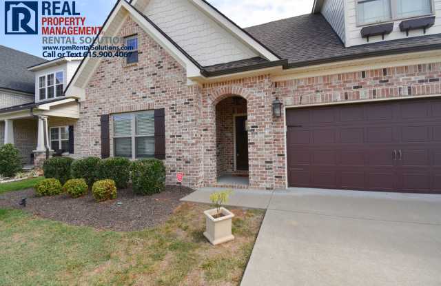 Photo of All brick 4 bedroom home plus Bonus room! Garage and covered patio!