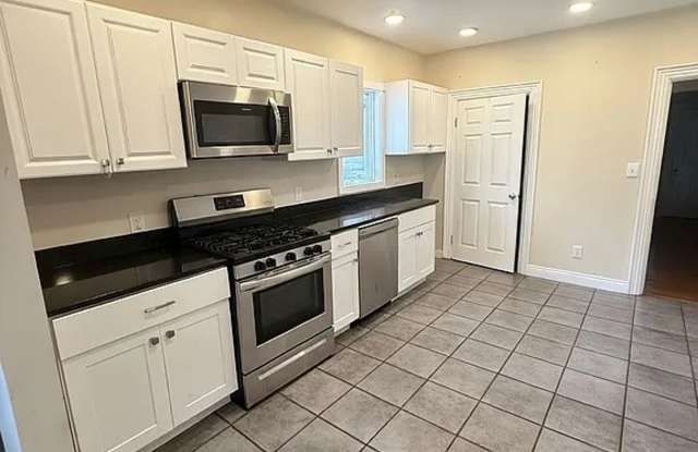 No Fee Single Family House with 5 Parking Spaces Included!  Laundry in Unit!