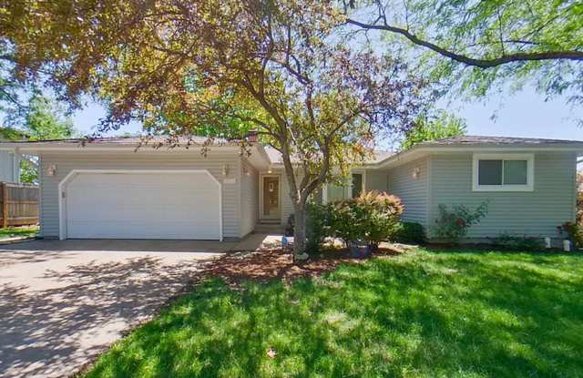 Spacious West Manhattan Home with Fenced Yard, Basement & Bonus Room!