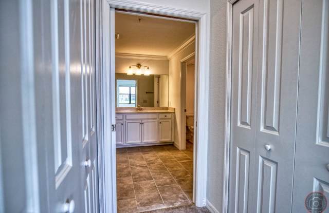 Annual Unfurnished Rental – Coach Home 3 Bedrooms, 2 Baths, 2 Car Garage, with Resort Like Amenities – Gran Paradiso Community!