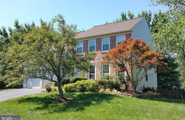Expansive living meets timeless elegance in this beautifully appointed five bedroom brick front residence in the highly desirable Emerald Chase community.