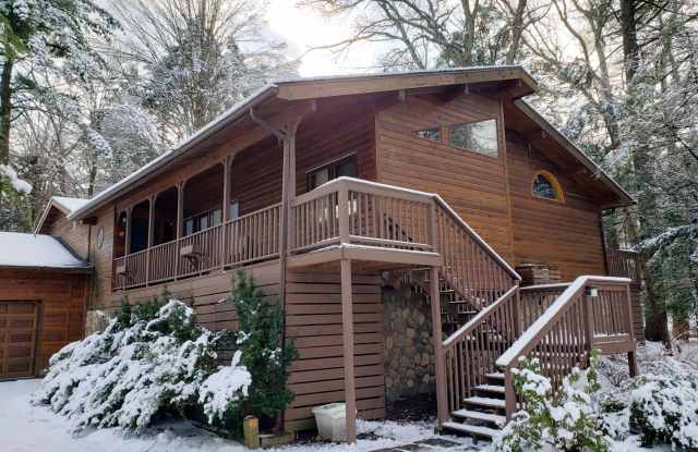 Photo of Gorgeous River Front Cabin in the Woods Fully Furnished with Hot Tub!