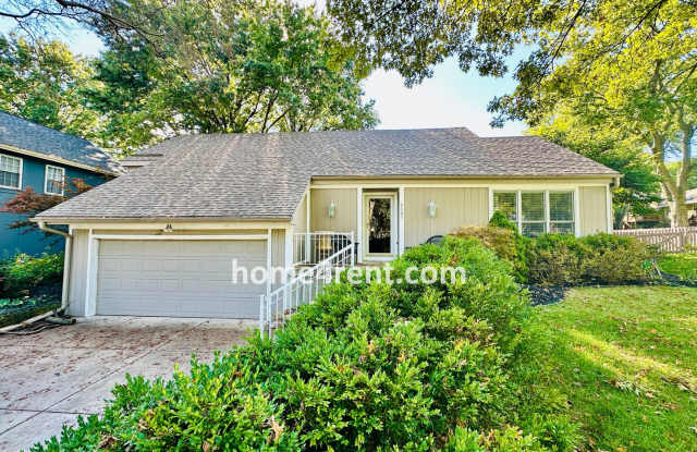 A Lovely Lenexa Home w/ Wood Floors Throughout, Updated Kitchen, Finished Basement and a Fenced Yard!