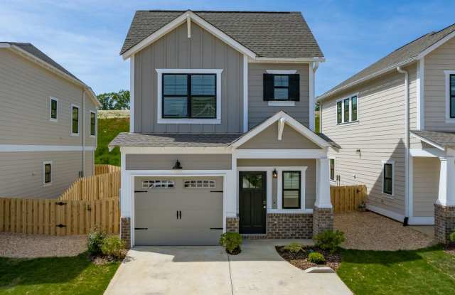 Single Family Home with Garage and Fenced Backyard