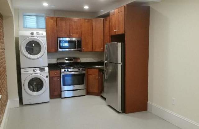$2300 | Renovated Brookline 1-Bedroom with In-Unit Laundry & Utilities Included