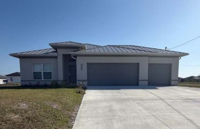Like-New Cape Coral Home with 3-Car Garage, Fenced Yard & Modern Upgrades!