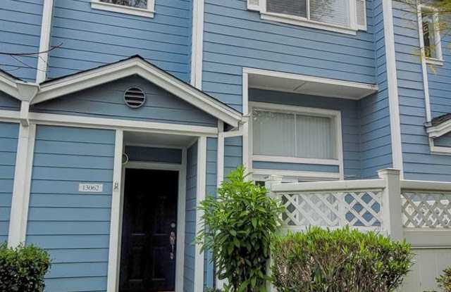 COMING IN FEBRUARY! 2 Bedroom 2.5 Bath Gated Townhouse with Attached Garage and Two Community Pools- Small Dog Friendly