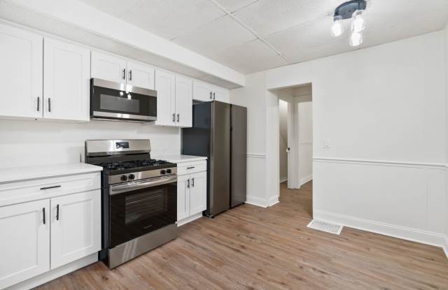 Photo of 4 bed 1.5 bath - completely updated, central air, patio. Great location