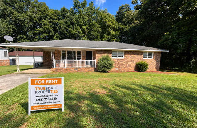 3br 2ba brick home with carport and fenced in yard.