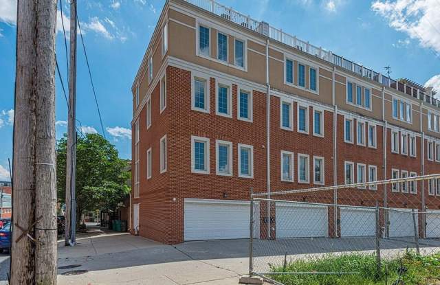 Beautiful EOG 3 bedroom 2.5 bath townhome with a 2 car garage and roof top deck overlooking the water and city.