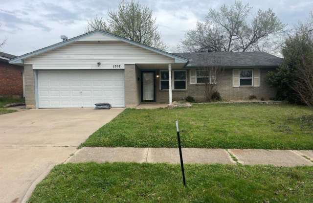 3 bed 1.5 bath in Norman! Partial garage conversion for a cozy bonus room and storage space, stainless appliances and a covered back patio! - 1707 Village Drive, Norman, OK 73071