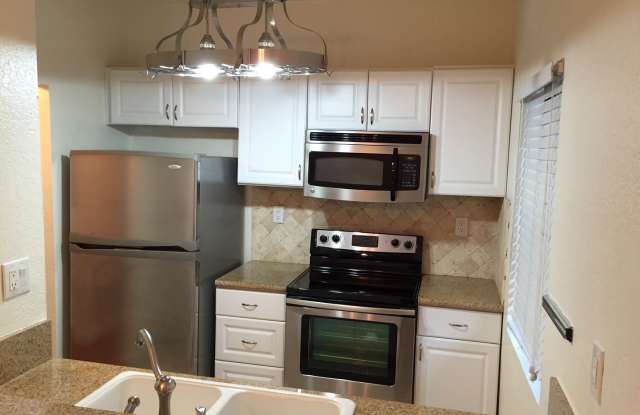 Photo of Beautiful 1 Bed/1 Bath Condo Apartment with Patio, Hardwood Flooring, Central AC, Washer and Dryer hookups, and Granite Countertops