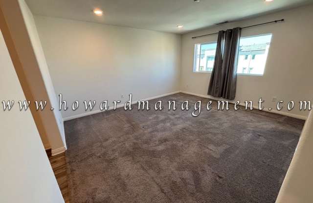 3 Bed 3 Bath, Three Story Townhome with private garage, Large Living Space, Private Patio with Washer/dryer in unit