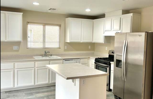 SW!!! OVER 2000 SQ FT!!! New Carpet!!! New Flooring!!! Freshly Painted!!! 4 bed 3 bath!!! Low Maintenance Desert landscape Front and back!!!