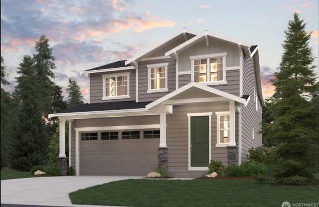 Photo of Modern 4-Bedroom Home with Bonus Room  Luxury Primary Suite in Sinclair Ridge
