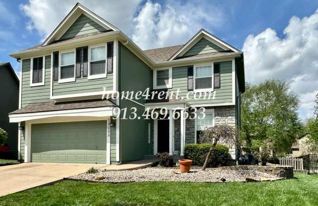 Updated Kitchen, Large Two Tiered Deck, Finished Basement in Blue Valley Schools!