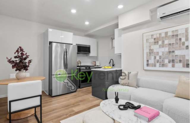 Rare Renovated 3BR/2BA Townhouse with Private Yard & NYC Views