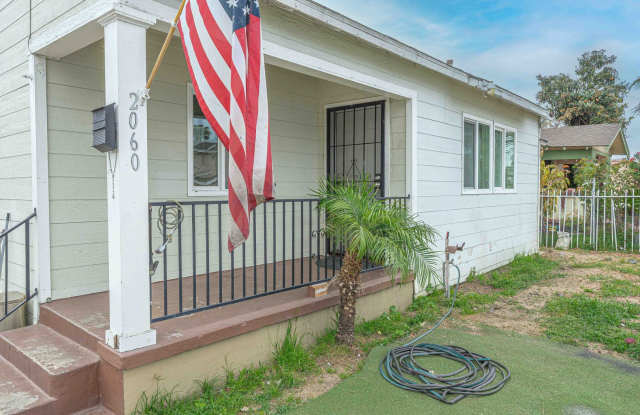 Photo of Cozy 4BR/1BA home with front yard