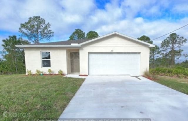 1127 Bayliss Street East - 1127 Bayliss Street East, Lehigh Acres, FL 33974