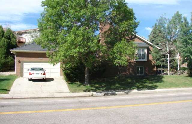 Beautifully Updated 5 Bedroom Rockrimmon Ranch Home Backing to Open Space