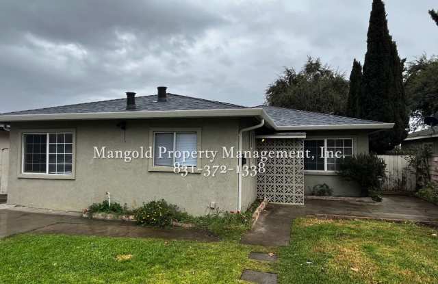 Inviting 4 Bed/2 Bath Home with Spacious Backyard