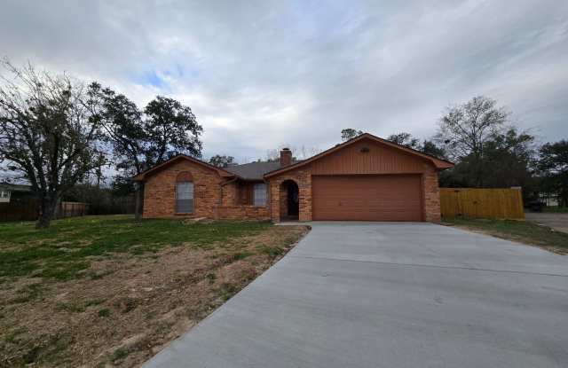 Bryan, 3 Bedroom 2 Bath Home, 2 car garage, large back yard and two fireplaces.