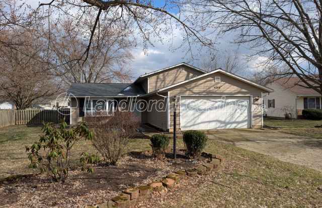 Spacious Elyria Split-Level Near LCCC with Fireplace  Fenced Yard