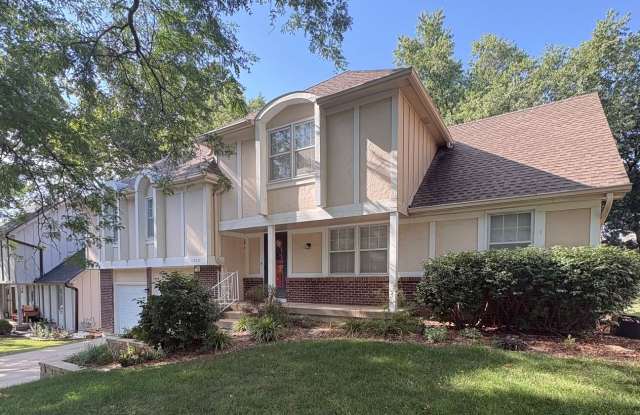 2 Separate Living Spaces in One Home! 5 Bedroom/3 Bath Overland Park Home with Finished Lower Living Suite & Partially Fenced Backyard